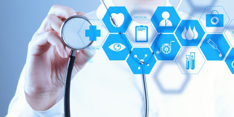 Doctor with stethoscope on screen with health graphics