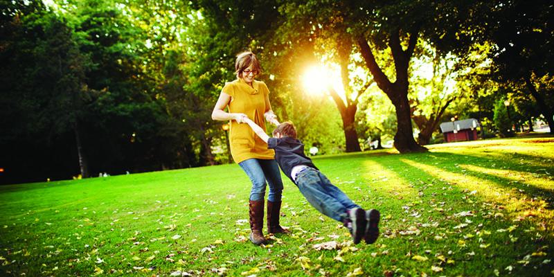 Adult and child in park