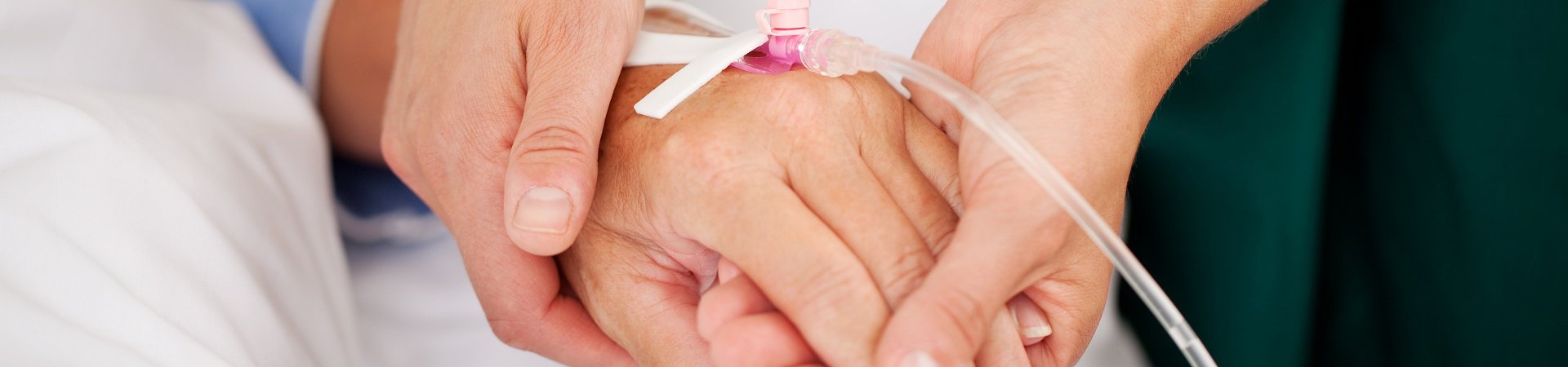 nurse holding patient hand