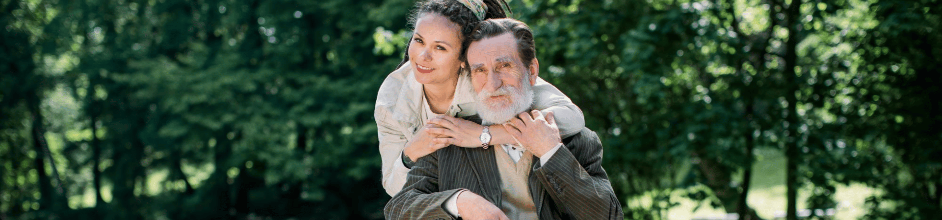 man in wheelchair with carer