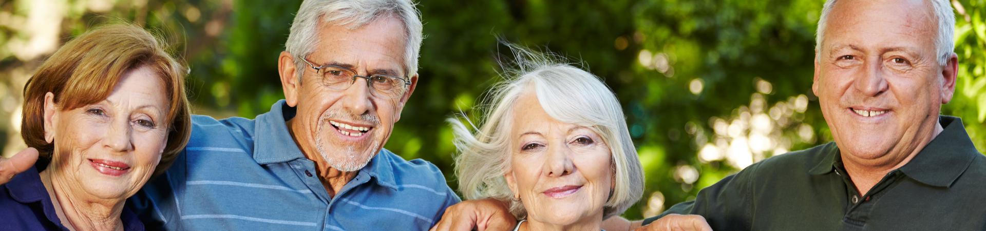 Four elderly people in the park